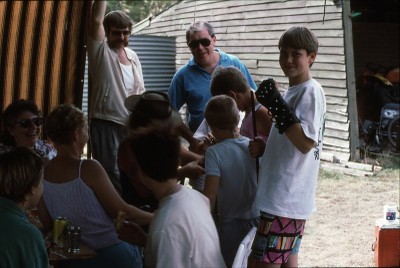 Peter Bye showing kids his bikie toys.